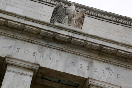 An eagle tops the U.S. Federal Reserve building's facade in Washington, July 31, 2013. Photo by Jonathan Ernst/REUTERS/