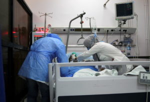 COVID-19 patients receive treatment inside a hospital in Damascus