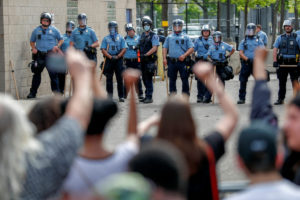 People gather at the Minneapolis Police Department's Third Precinct station to protest the death of George Floyd