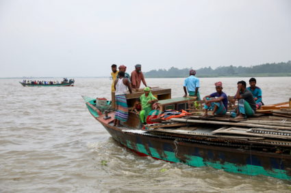 Residents who live on the bank of the Padma river shift their houses to a safer place as the river bank about to disintegr...