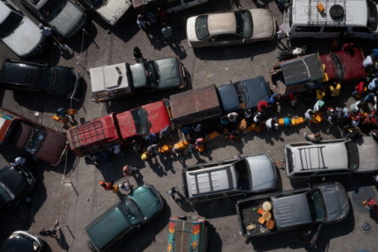 Locals line up between vehicles to get gasoline at a fuel station amid a nationwide shortage of fuel in Port-au-Prince, Haiti November 1, 2021. Picture taken by a drone. Photo by Adrees Latif/REUTERS