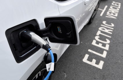 An electric car is charged at a roadside EV charge point, London, October 19, 2021. Photo by Toby Melville/REUTERS