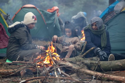 Migrants gather on the Belarusian-Polish border