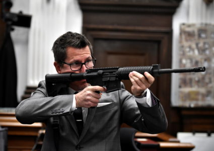 Assistant District Attorney Thomas Binger holds Kyle Rittenhouse's gun as he gives the state's closing argument in Kyle Rittenhouse's trial Kenosha County Courthouse, Wisconsin, U.S. November 15, 2021. Photo by Sean Krajacic/Pool via REUTERS