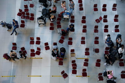 Travellers wait for documents checking, at the arrival terminal of Soekarno Hatta International airport, as the country bans the arrival of travellers who have been in eight African countries to curb the spread of the new Omicron variant of the coronavirus, in Tangerang, near Jakarta, Indonesia, November 29, 2021. Photo by Willy Kurniawan/REUTERS