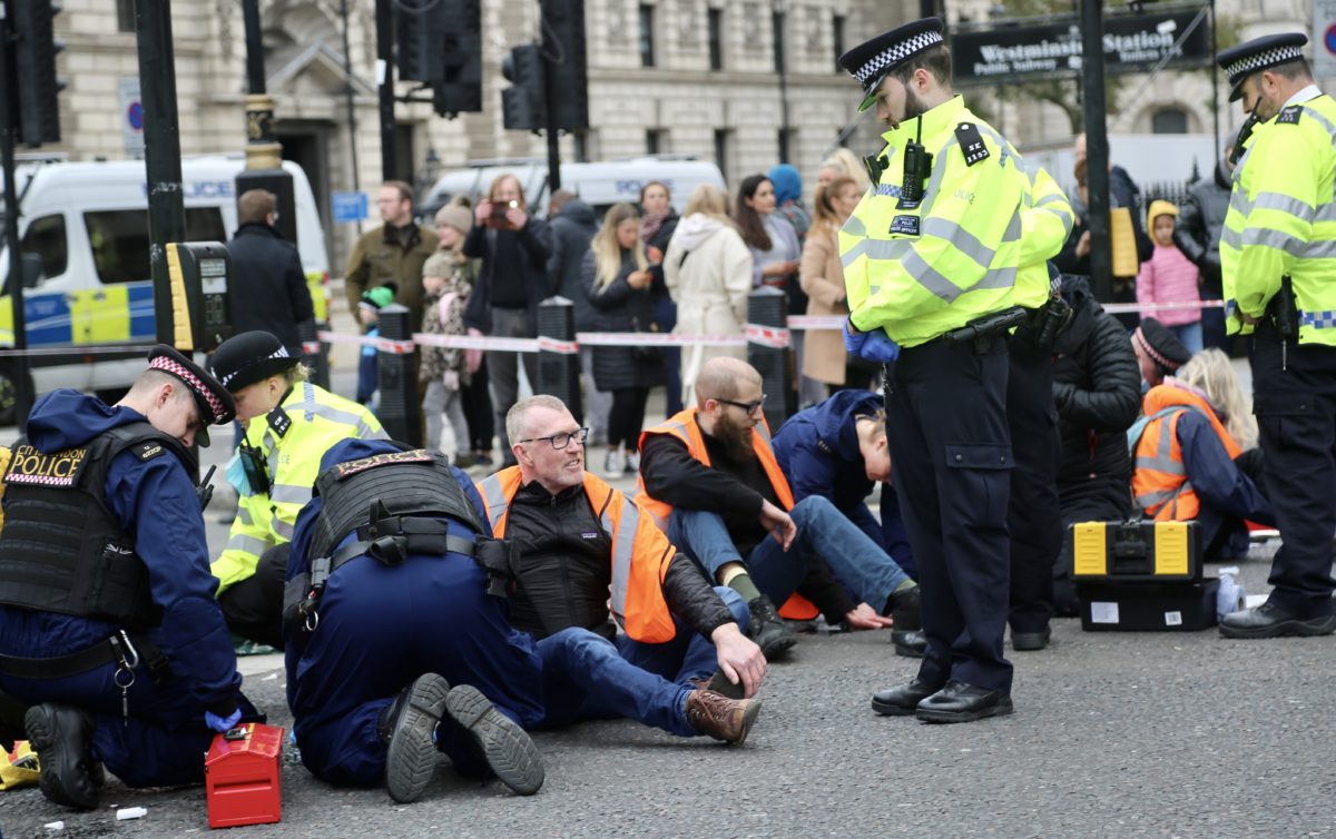 Climate protesters block roads outside UK Parliament PBS NewsHour
