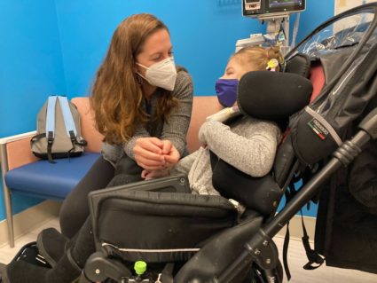 Health care worker and mother, Caitlin Givens, sits with her daughter, Penelope Porter, 6, after Porter received her first dose of Pfizer-BioNTech's COVID-19 vaccine, which became available for U.S. children ages 5-11 this week. Photo by Laura Santhanam/PBS NewsHour