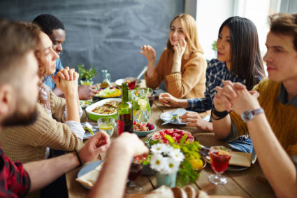 FILE IMAGE: Group of friends having Thanksgiving dinner.