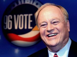 Max Cleland, Democratic candidate for the United States Senate, jokes with the press after a debate ..