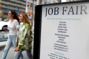 Signage for a job fair is seen on 5th Avenue after the release of the jobs report in Manhattan, New York City