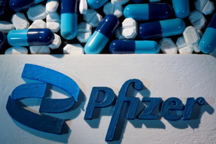 FILE PHOTO: A 3D printed Pfizer logo is placed near medicines from the same manufacturer in this illustration