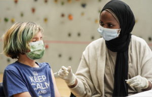 Children receive COVID-19 vaccines at a school-day clinic in Seattle