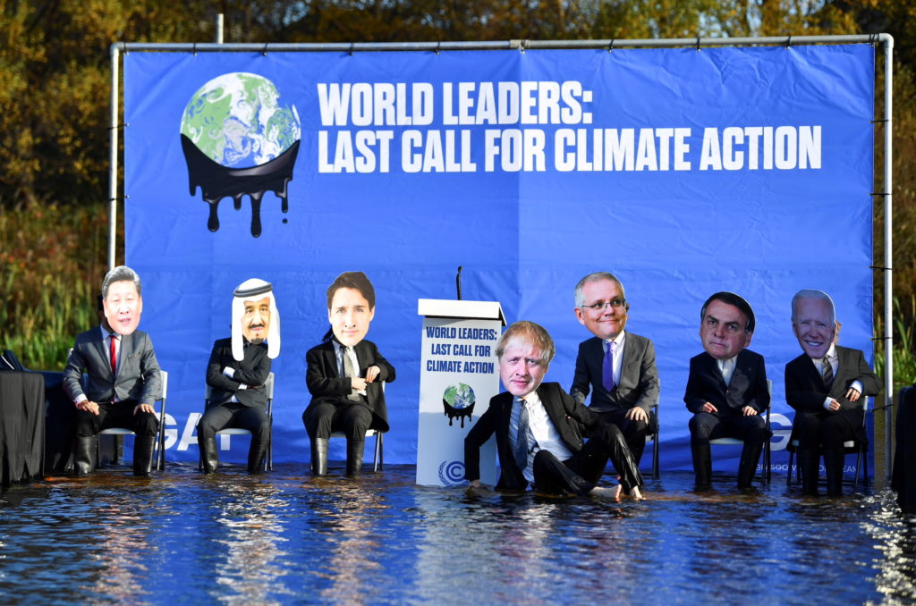 FILE PHOTO: Activists protest against the rising water levels, in Glasgow