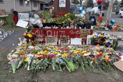 Mourners pay their respects by leaving mementos at Daunte Wright’s memorial, where former Brooklyn Center police officer Kim Potter fatally shot him during a traffic stop in Brooklyn Center, Minnesota, U.S. April 17, 2021. Photo by Octavio Jones/REUTERS