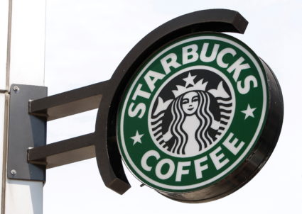 The Starbucks sign is seen outside one of its stores in New York July 3, 2008. Photo by Chip East/REUTERS