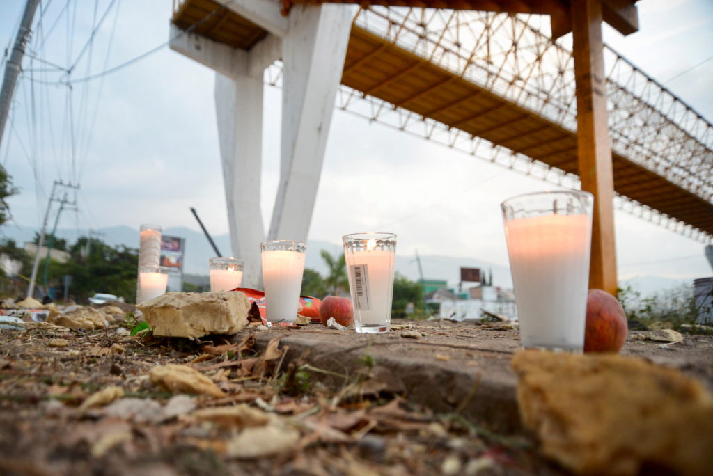 Votive candles are pictured at the site of a truck accident in Tuxtla Gutierrez
