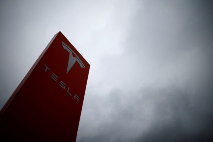The logo of Tesla is pictured at a dealership in Chambourcy, near Paris, France, December 15, 2021. Photo by Gonzalo Fuentes/REUTERS