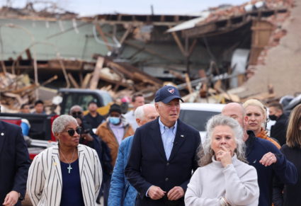 U.S. President Joe Biden surveys storm damage from the tornadoes and extreme weather as he tours a neighborhood with Kentucky's first lady Britainy Beshear, Mayfield's Mayor Kathy O'Nan and Anne Henning Byfield, Presiding Bishop of the AME Council of Bishops, in Mayfield, Kentucky, U.S., December 15, 2021. Photo by Evelyn Hockstein/REUTERS