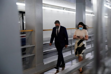U.S. Senator Joe Manchin (D-WV) walks back to his office through the Senate subway after a Democratic policy luncheon at t...