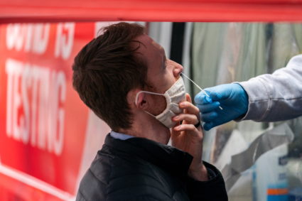 A man takes a coronavirus disease (COVID-19) test at a pop-up testing site in New York City