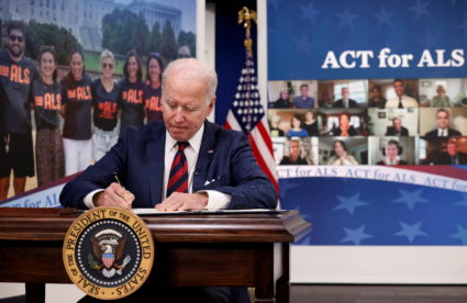 U.S. President Joe Biden signs into law the Accelerating Access to Critical Therapies for ALS Act in the South Court Auditorium at the White House in Washington, U.S., December 23, 2021. Photo by Evelyn Hockstein/REUTERS