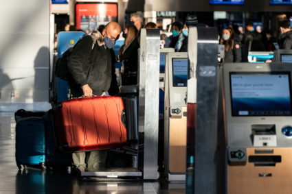 Passengers line up at John F. Kennedy International Airport in New York