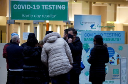 People wait outside a COVID-19 testing centre, amid the coronavirus disease (COVID-19) outbreak in Manchester
