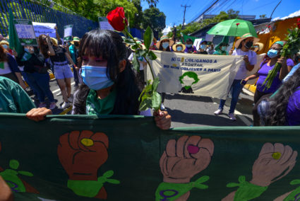 Women seen marching with a pro-choice banner during the