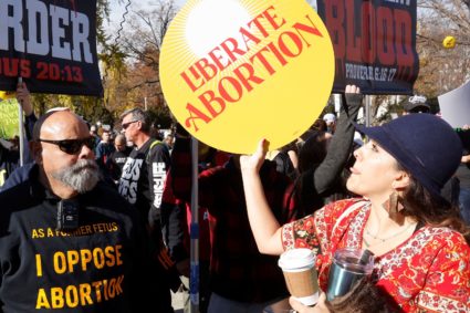 Anti-abortion and pro-abortion rights protesters gather outside Supreme Court in Washington