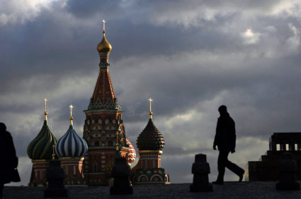People walk across Red Square in Moscow as St.Basil's Cathedral is seen in the background