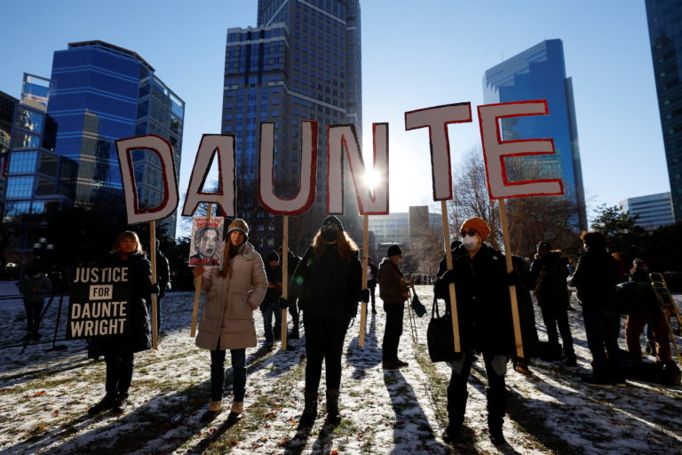 People react to the outcome in the manslaughter trial of Kimberly Potter, the former Minnesota police officer who killed Black motorist Daunte Wright after mistaking her handgun for her Taser during a traffic stop, outside the Hennepin County Courthouse in Minneapolis, Minnesota, U.S. December 23, 2021. Photo by Adam Bettcher/REUTERS