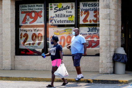 FILE PHOTO: Shoppers leave a Piggly Wiggly supermarket in Columbus