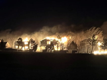 Houses are engulfed in flames as Marshall Fire spreads in Superior, Colorado, U.S. December 30, 2021. Picture taken December 30, 2021. Photo by Sean David Van de Riet/via REUTERS