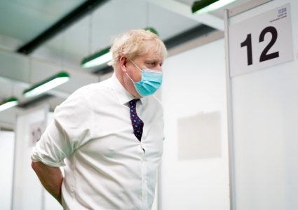 Britain's Prime Minister Boris Johnson looks on during a visit to a COVID-19 vaccination hub in the Guttman Centre at Stoke Mandeville Stadium in Aylesbury, Buckinghamshire, Britain January 3, 2022. Photo by Steve Parsons/Pool via REUTERS