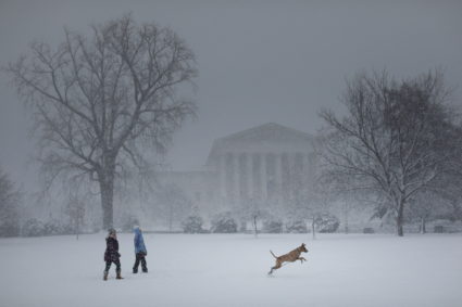 Snow falls during a winter storm on Capitol Hill, in Washington