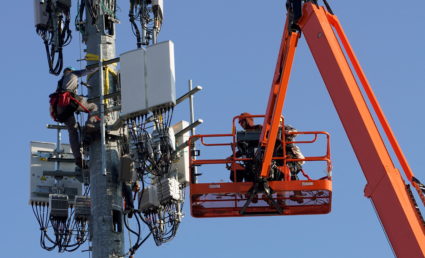 FILE PHOTO: A contract crew from Verizon installs 5G equipment on a tower in Orem