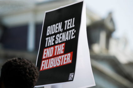 Activists push for voting rights legislation during news conference near the White House in Washington