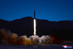 FILE PHOTO: A missile is launched during what state media report is a hypersonic missile test at an undisclosed location i...