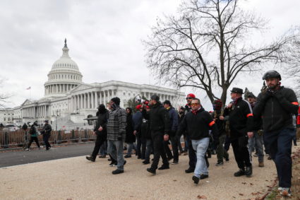 FILE PHOTO: Members of the the far-right group Proud Boys march to the U.S. Capitol Building in Washington