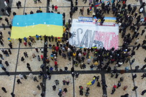 Anti-Putin protesters hold a rally in Kyiv