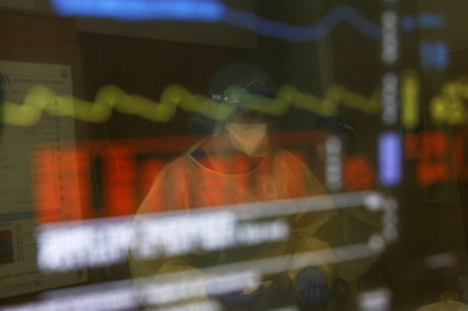 A registered nurse is seen reflected in the electrocardiogram monitor of a COVID-19 patient, in his isolation room at Madison Memorial Hospital in Rexburg, Idaho, U.S., October 28, 2021. Photo by Shannon Stapleton/REUTERS