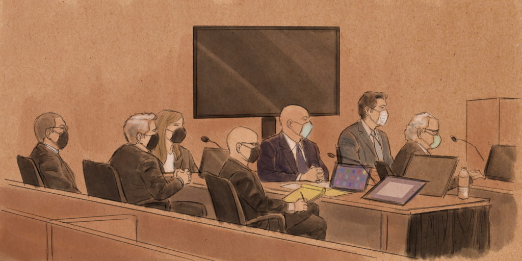 Three former Minneapolis officers, Tou Thao, J. Alexander Kueng and Thomas Lane, sit with their lawyers during their trial...