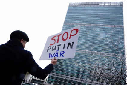 A man protests across the street from United Nations Headquarters in New York City
