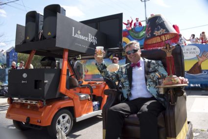 A member of the Krewe of Laissez Boys salutes the crowd.