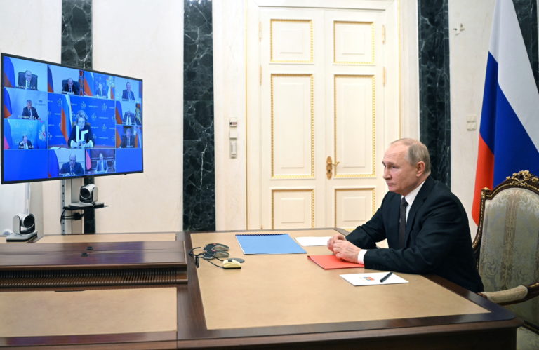 Russian President Vladimir Putin chairs a meeting outside Moscow