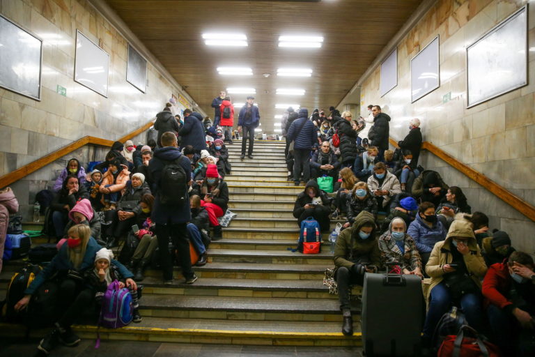 People take shelter in a subway station, after Russian President Vladimir Putin authorized a military operation in eastern...