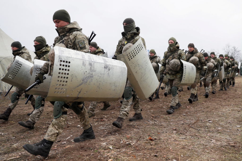 FILE PHOTO: Members of the Ukrainian State Border Guard Service attend a training session near the border with Belarus and...