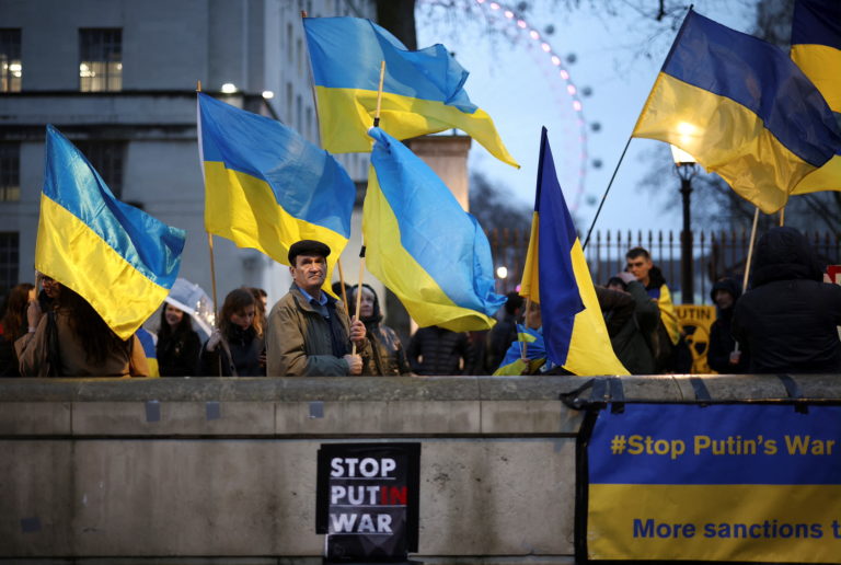 People attend a pro-Ukrainian demonstration on Whitehall, opposite Downing Street, in central London