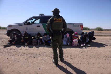 FILE PHOTO: A group of asylum seekers from Mexico, Cuba and Haiti are detained by U.S. Border Patrol in San Luis