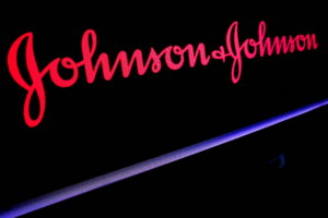 FILE PHOTO: The Johnson &amp; Johnson logo is displayed on a screen on the floor of the NYSE in New York